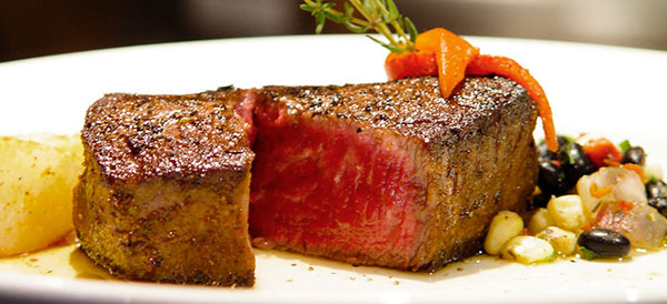 Steak on plate with vegetables